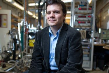 Pablo Jarillo-Herrero sitting in his laboratory