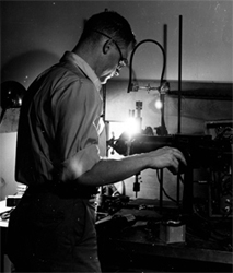 Henry W. Kendall, shown here as a graduate student at MIT experimenting with high-intensity microwave excited glow discharge.