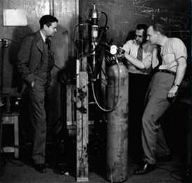 John C. Slater (left) watches Associate Professor Melvin A. Herlin (right) and a technician in the low-temperature laboratories of the Research Laboratory of Electronics (RLE), 1949.