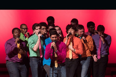 Photo showing MIT senior Shaun Datta, at center performing with his fellow MIT Logarhythms.