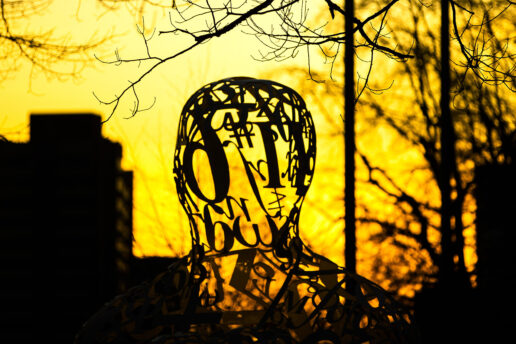 Alchemist sculpture at sunset