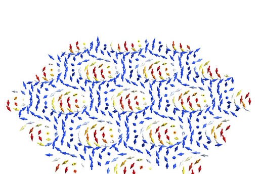 Artist’s rendition of skyrmions, exotic particles represented by the whirls of red, yellow, and white arrows.