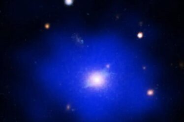 SPT2215 relaxed galaxy cluster in composite image by Chandra, Hubble, and other space instruments