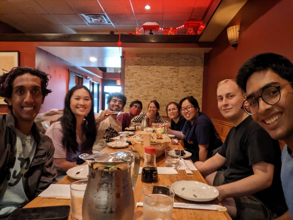 SPS executives sit/pose around table