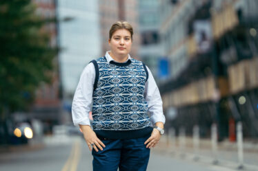 student standing in street posing