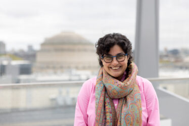 Nergis Mavalvala poses in front of MIT dome