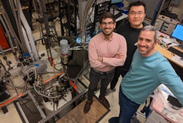 three physicists in their lab