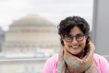 Nergis Mavalvala poses in front of MIT dome